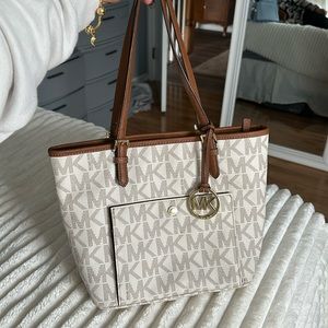 MK white monogram tote purse with brown and gold detailing